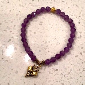 Purple beaded bracelet with gold tone heart